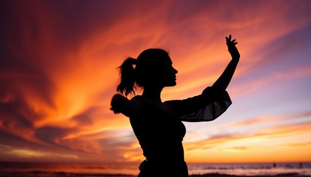 Woman silhouette against sunset at beach for 25th birthday photoshoot