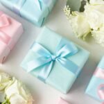 The Ultimate Guide to Happy Birthday Gifts: Pinterest-Worthy Ideas They'll Love A beautifully arranged birthday gift display with wrapped presents in complementary colors, ribbons, and fresh flowers