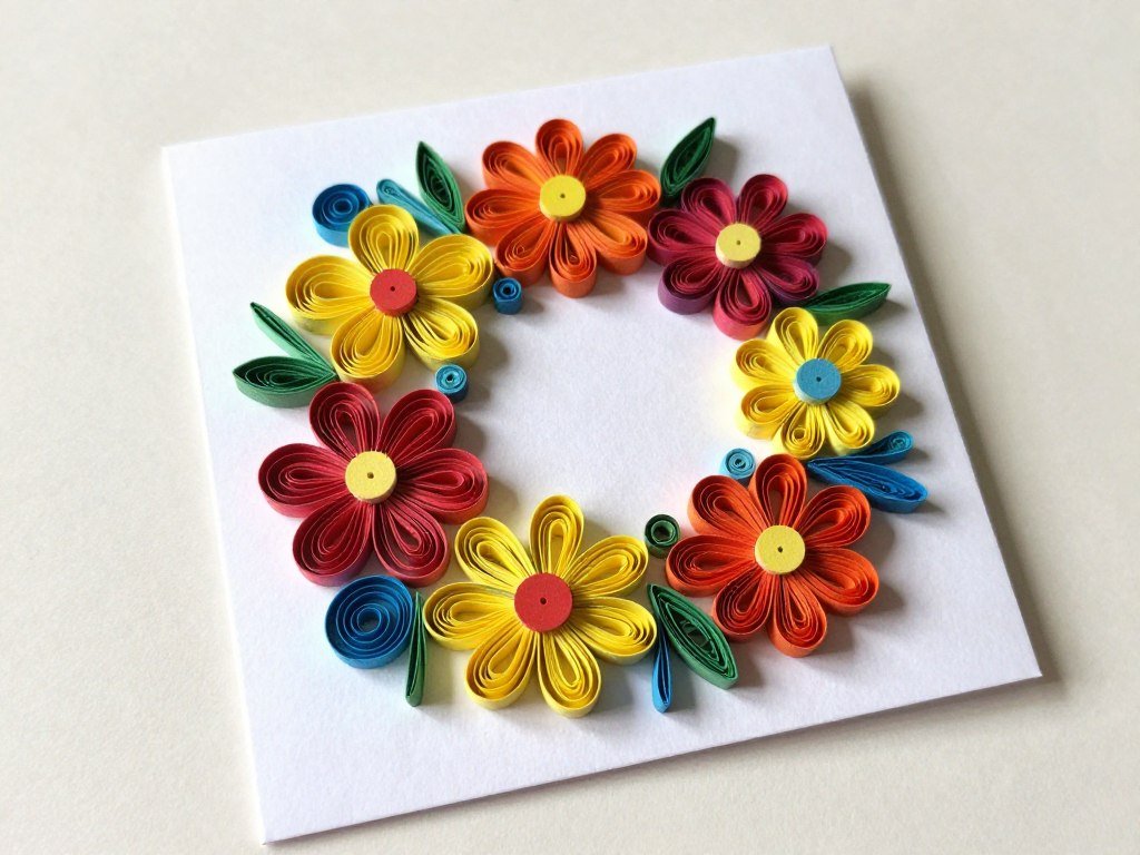 A handmade birthday card featuring intricate paper quilling flowers and swirls in bright colors A handmade birthday card featuring intricate paper quilling flowers and swirls in bright colors