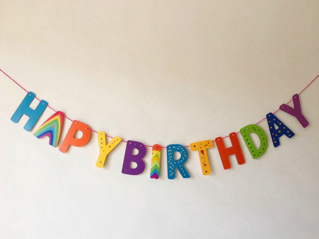 Colorful paper garland happy birthday banner with scalloped edges Colorful paper garland happy birthday banner with scalloped edges