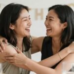 Heartfelt Happy Birthday Sister in Law: Messages & Celebration Ideas Two women laughing and embracing, celebrating a happy birthday sister in law moment