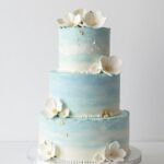 aesthetic blue cake designs girly with pastel frosting and floral accents
