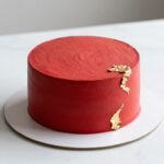 aesthetic cake designs korean red featuring elegant minimalist design with red buttercream and gold accents