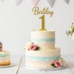 1st Birthday Cake Designs for Kids: 25+ Adorable Ideas colorful first birthday cake with number one topper and smash cake setup