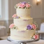 floral birthday cakes decorated with pastel buttercream roses and fresh flowers