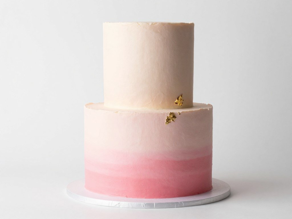 ombre 50th birthday cake transitioning from blush to deep rose pink